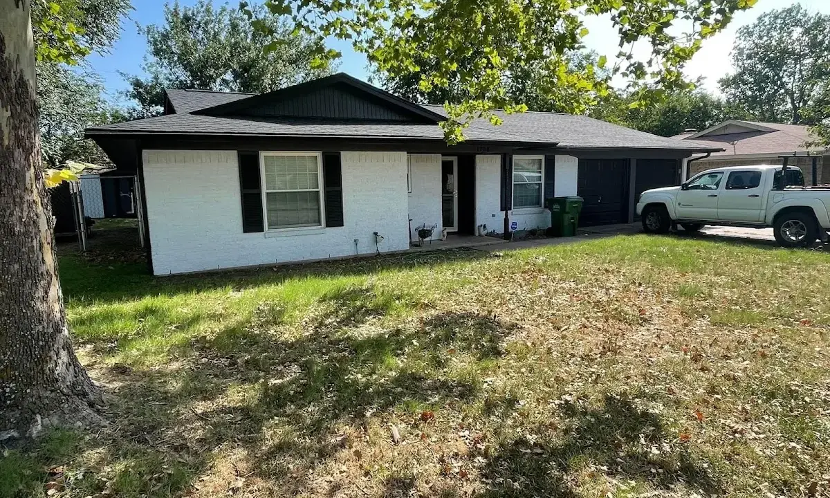Professional roofing crew working on a residential roof in Riverview